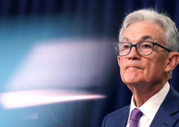 Fed holds interest rates but keeps door open to a cut in coming months